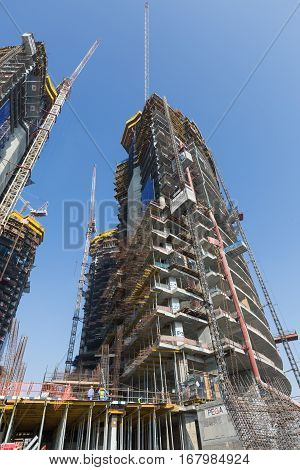 United Arab Emirates, Dubai, 05/21/2015, Damac Towers Dubai by Paramount, construction and building ariel views with cityscape background