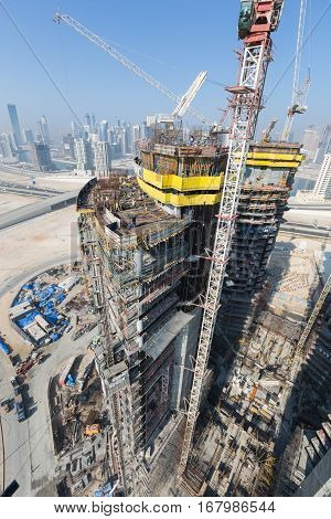 United Arab Emirates, Dubai, 05/21/2015, Damac Towers Dubai by Paramount, construction and building ariel views with cityscape background