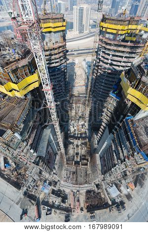 United Arab Emirates, Dubai, 05/21/2015, Damac Towers Dubai by Paramount, construction and building ariel views with cityscape background