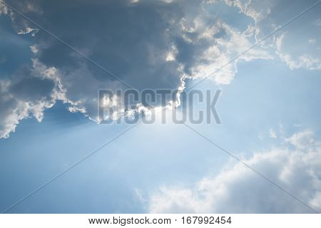 The sun breaks through the storm cloud