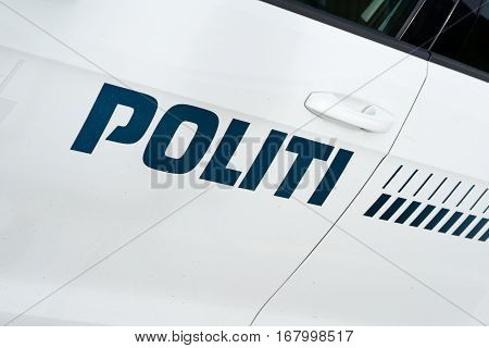 Staged photo with police car in Denmark.