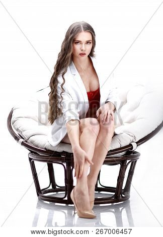 Close Up. Portrait Of Sexy Young Woman In Lingerie Sitting In Papasan Chair