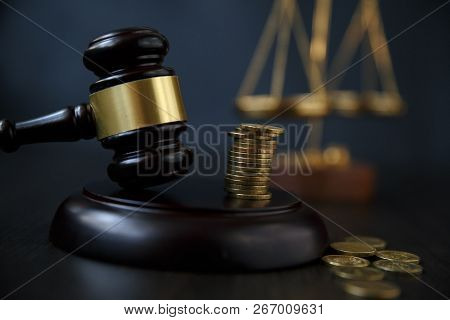 Legal Gavel And Coins In A Coin Jar