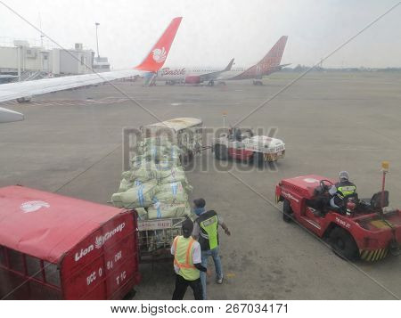 Jakarta, Indonesia - October 28, 2018: Freight Train Containing Baggage Of Aircraft Passengers Are R