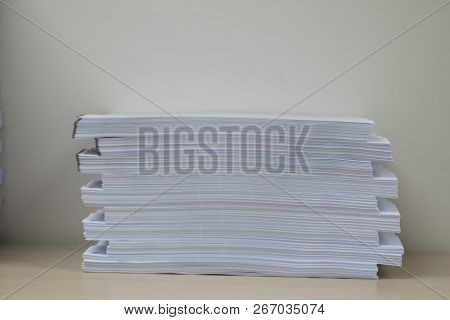 Pile Of Unfinished Documents On Office Desk Folders. Business Papers Or Document Is Written. Busines