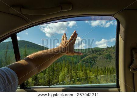 The Man's Arm, Covered With Hair, Is Open, Showing The Sign Of Startrek By The Fingers Spread