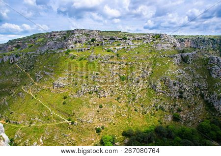 View Of Ravine Canyon With Rocks And Houses In Caves Di Murgia Timone Near Old Ancient Town Matera (