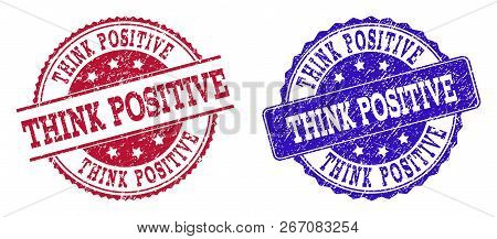 Grunge Think Positive Seal Stamps In Blue And Red Colors. Stamps Have Distress Surface. Vector Rubbe