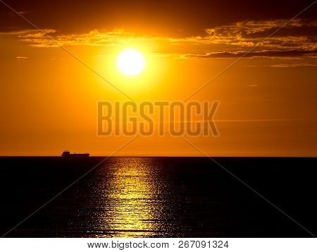 Beautiful Sunset Over The Sea, Ship On The Horizon
