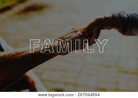 Man Bro-fist Greets Boy. Disabled In Wheelchair. Family Rehabilitation Therapy. Grandpa Sit In Wheel
