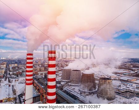 Aerial Top View Clouds Of Smoke And Steam Cooling Tower Industrial Heat Electro Central Coal. Enviro