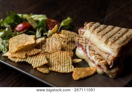 Turkish Toast Or Tost / Triangle Club Sandwich With Melted Cheese, Ham And Served With Chips And Sal