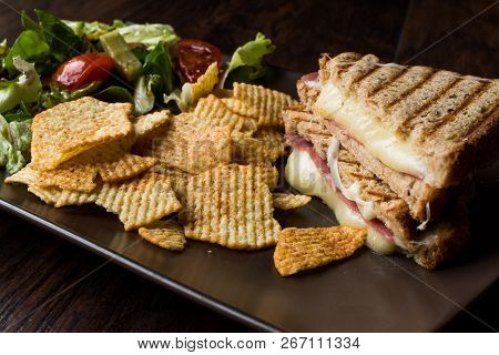 Turkish Toast Or Tost / Triangle Club Sandwich With Melted Cheese, Ham And Served With Chips And Sal