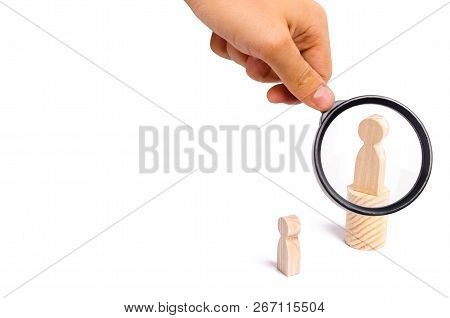 Magnifying glass is looking at the men stands on the podium and broadcasts his thoughts and ideas to listeners. person gives orders, the leader. Pride, boastfulness.