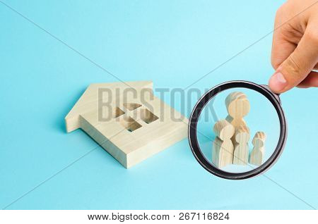 Magnifying Glass Is Looking At The Family Stands Near The Ruined Fallen House. Buying Immobility Hom