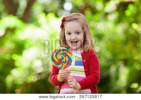 Kids Wearing Colorful Rainbow Socks. Children Footwear Collection. Variety Of Knitted Knee High Sock