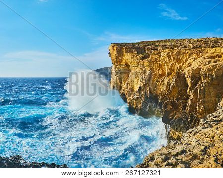 The Tall Cliffs Of San Lawrenz Are Safe Place To Watch The Storm With Strong Waves, Crashing Against