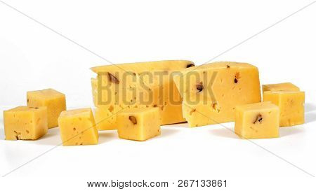 pieces of cheese with nuts on a white background