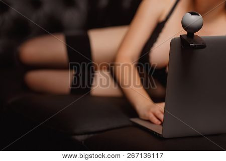 Woman Working As Internet Webcam Model. Shows Breasts. Concept Virtual Sex Chat.