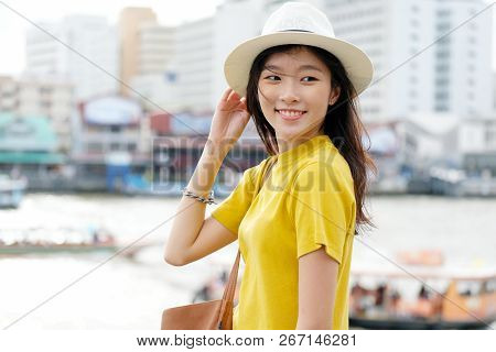 Young Asian Woman Portrait Smiling With Happiness At City Outdoors Background, Casual Lifesyle, Trav