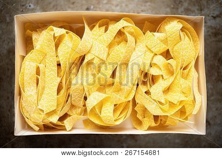 Close Up Uncooked Ristic Italian Pappardelle Pasta