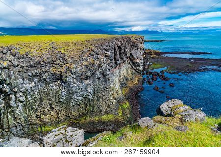 Beautiful View Of Volcanic Basalt Rocks Cliff On The Coastline At Arnarstapi Fishing Village In The 