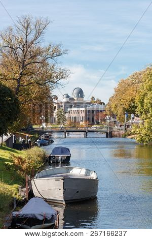 View Of The Channels Of City Leiden, Bots And Trees, Leiden Observatory Background.