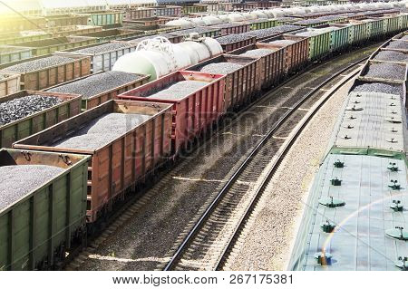 Rail Cars Loaded With Coal, A Train Transports Coal. Many Different Rail Cars.