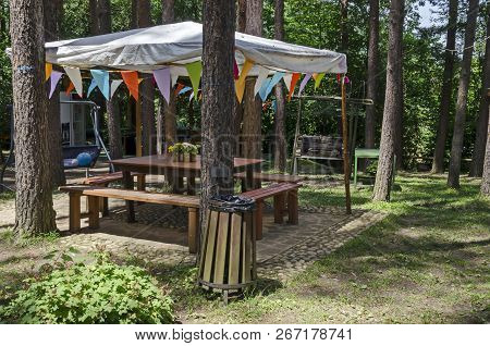 Lozen Mountain, Bulgaria - June 11, 2018: Summer Child Public Bivouac  With Table, Chair, Alcove  An