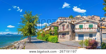 Street Of The Old City Of Siena Overlooking The Tower Of Torre Del Manja, Sienna. Italy