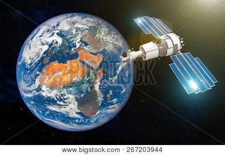 Research Satellite With Open Solar Panels In The Geostationary Orbit Of The Earth. Elements Of This 