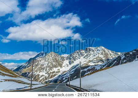 Road Amoung Snowy Alps Mountains, Fluelapass, Davos,  Graubuenden Switzerland