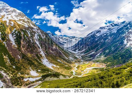 Mountain River In Alps Covered With Snow, Fluelapass, Zernez, Graubuenden, Switzerland