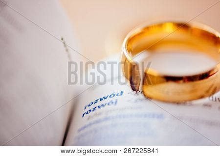 Two Broken Wedding Rings On Divorce Word In Polish Language In Dictionary. Divorce And Separation Co