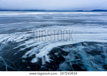 Lake Khubsugul Is Covered With Ice And Snow, Strong Cold, Thick Clear Blue Ice. Lake Khubsugul Is A 