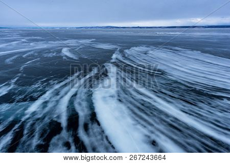 Lake Khubsugul Is Covered With Ice And Snow, Strong Cold, Thick Clear Blue Ice. Lake Khubsugul Is A 