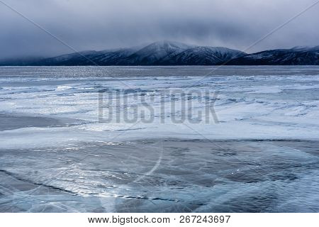 Lake Khubsugul Is Covered With Ice And Snow, Strong Cold, Thick Clear Blue Ice. Lake Khubsugul Is A 