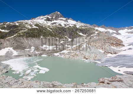 Rhone glacier, source of Rhone river, melting and retreating due to global warming. Rhone glacier is loosing up to 2 meters in length every year.