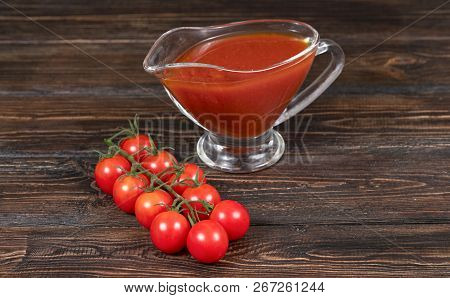 Chili Tomatoes And Tomato On Wooden Background
