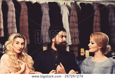 Friends In Shop: Ladies And Gentleman In Expensive Overcoats
