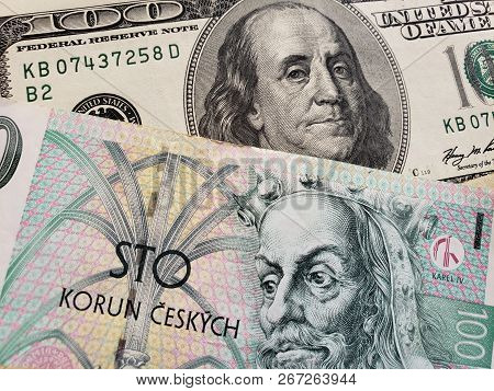 Approach To Czech Banknote Of 100 Korun And American 100 Dollar Bill, Background And Texture