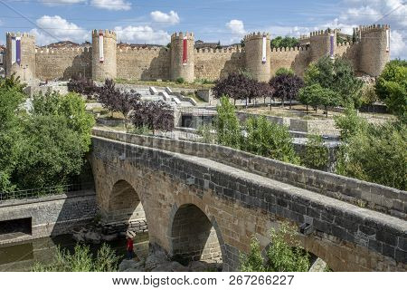 Stone Bridge And The Background Wall Of The City Of Avila