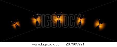 Set Of Shining Golden Butterflies On A Black Background. Stylized Insects For Decoration.