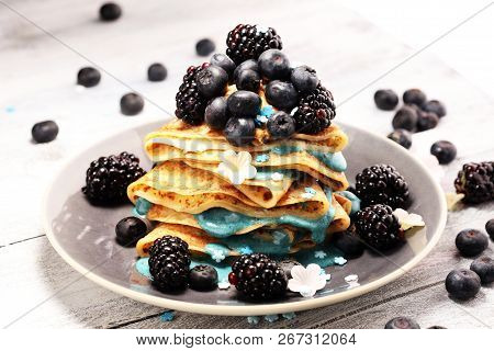 Delicious Tasty Homemade Crepes Or Pancakes With Blackberries,blueberries And Blue Spirulina Nicecre