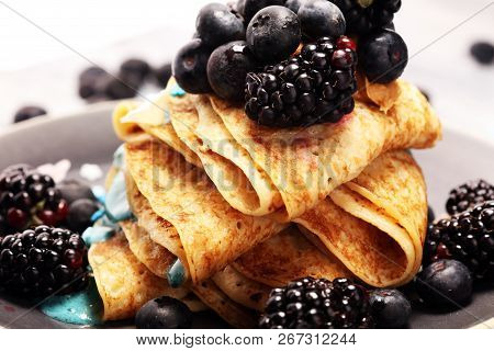 Delicious Tasty Homemade Crepes Or Pancakes With Blackberries,blueberries And Blue Spirulina Nicecre