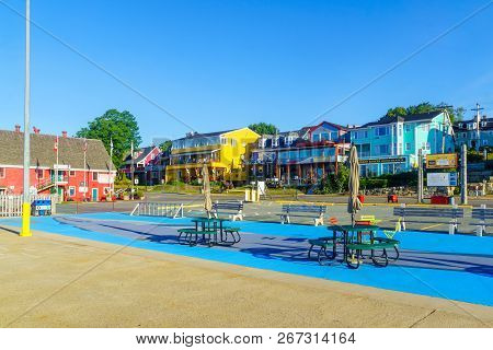 Lunenburg, Canada - September 21, 2018: Historic Houses In Bluenose Drive, With Tourists, In Lunenbu
