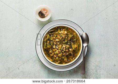 Gluten Free Green Minestrone With Cannellini Beans. On The Table With Spices And Arugula Pesto. Trad