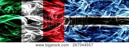 Italy Vs Botswana, Botswanan Smoke Flags Placed Side By Side. Thick Abstract Colored Silky Smoke Fla