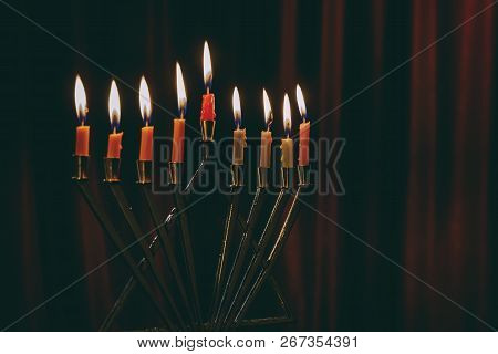 Burning Hanukkah Candles In A Menorah On Hanukkah Celebration With Menorah And Candles