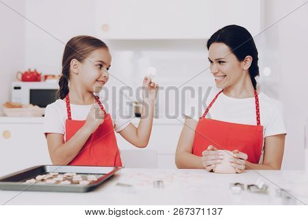 Good Work With Mom In Kitchen. Dough Knead With Mom. Little Girl With Mom. Bake With Mom In Kitchen.